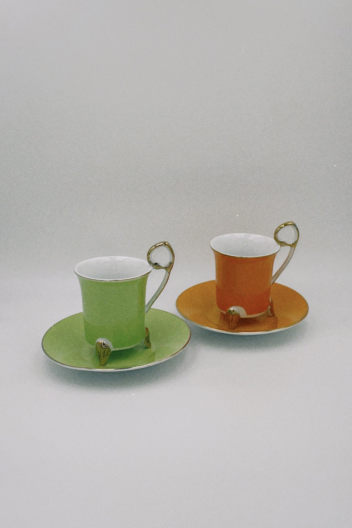 Porcelain Green and Orange cups set of two